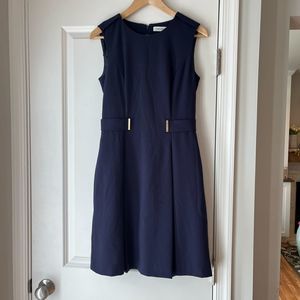 Calvin Klein navy dress with gold accents